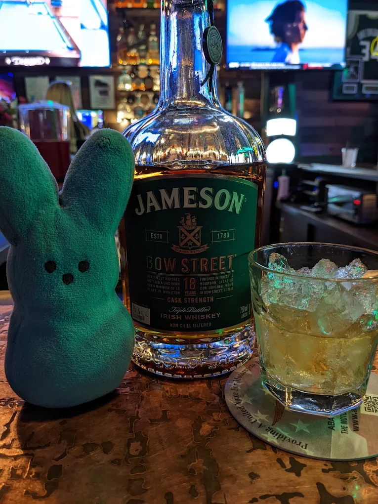 Jameson Bow Street 18 Year bottle beside a whiskey pour on the rocks